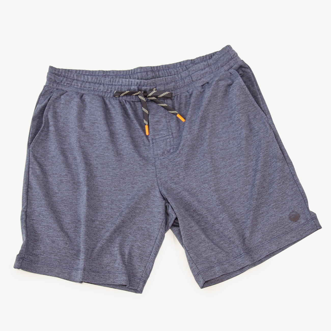 A pair of heathered navy athletic shorts for men from Hari Mari with an elastic waistband and a black-and-white striped drawstring with orange tips, shown flat on a light cream background.