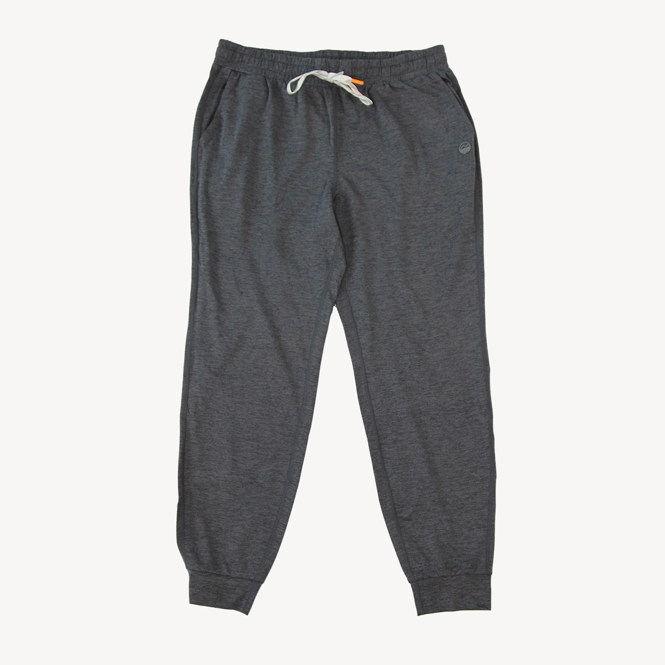 Dark heather gray joggers from Hari Mari with an elastic waistband, white drawstring, and a small logo patch on the left hip, shown against a plain off-white background.