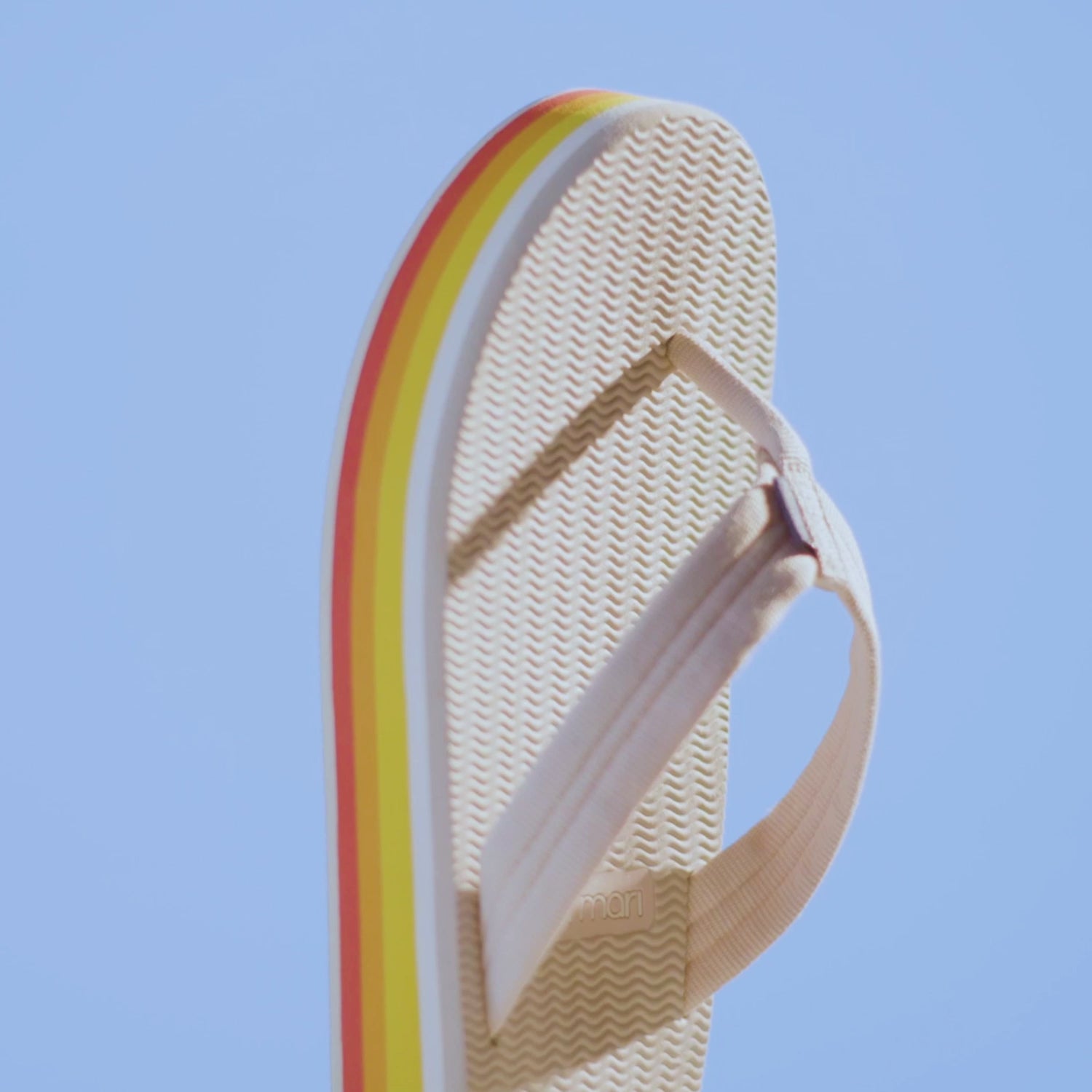 close up video showing the details of Hari Mari's Dunes Sunset flip flops for women