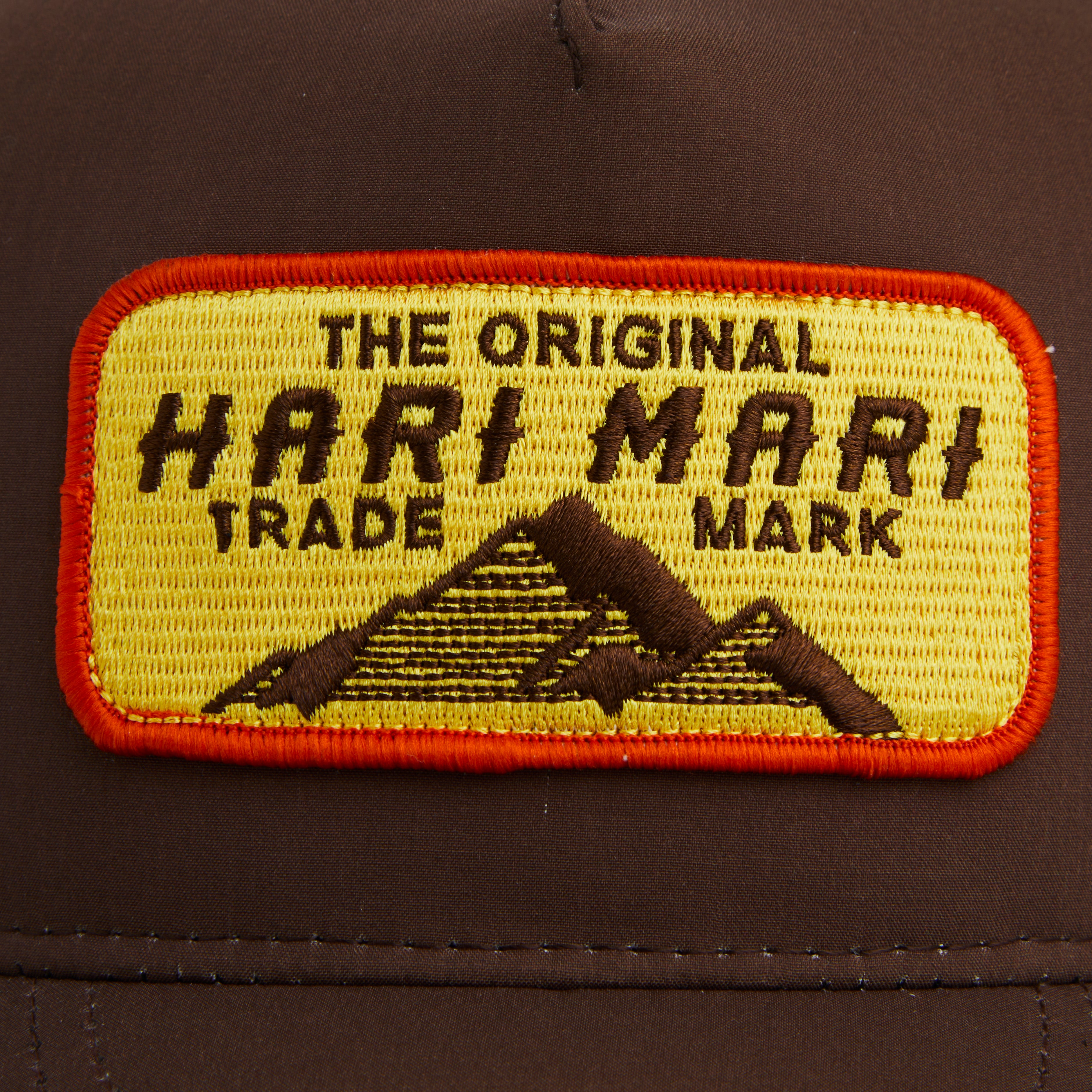 Up close image of the trucker hat patch from the Hari Mari trucker hat