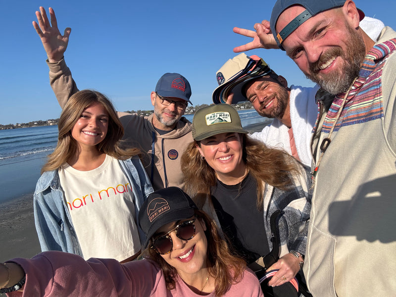 Group of people posing for a selfie by the beach during Hari Mari photoshoot