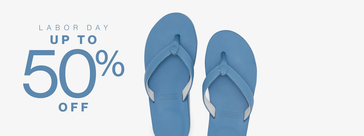 Blue leather flips flops featured on a grey background promoting "Labor Day Up to 50% off"