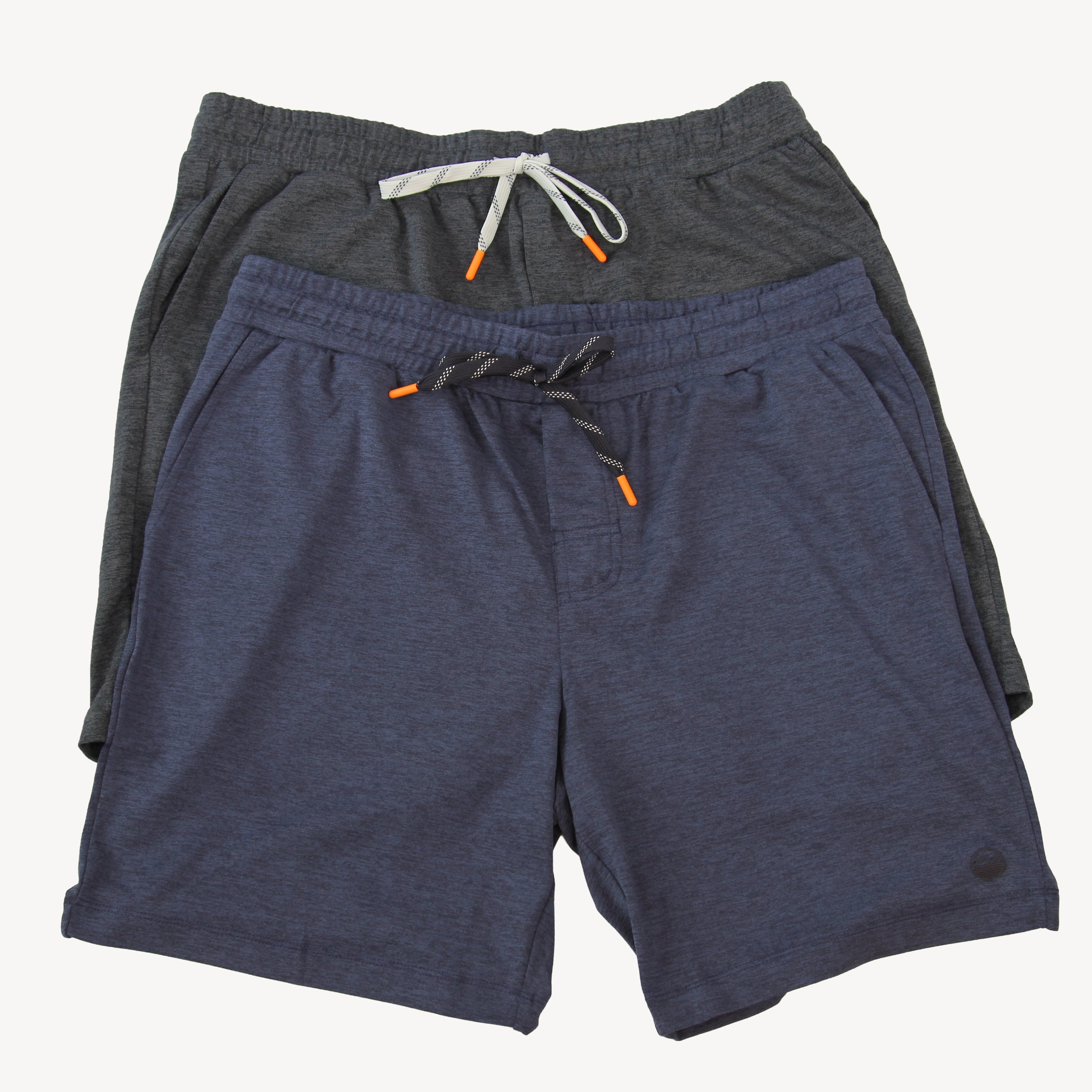 Two pairs of Hari Mari men's drawstring shorts stacked together on a light gray background. The front pair is heathered navy blue with a dark gray and white striped drawstring and orange tip accents, and the pair behind it is heathered dark gray with a white drawstring.