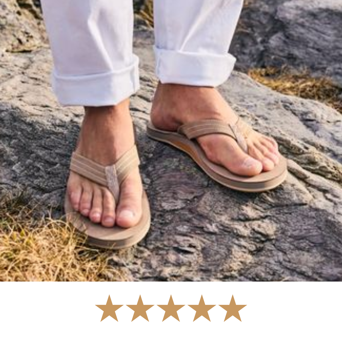 A person wearing beige thong sandals with white rolled-up pants, standing on a rocky outdoor surface. A row of five gold stars appears along the bottom edge.