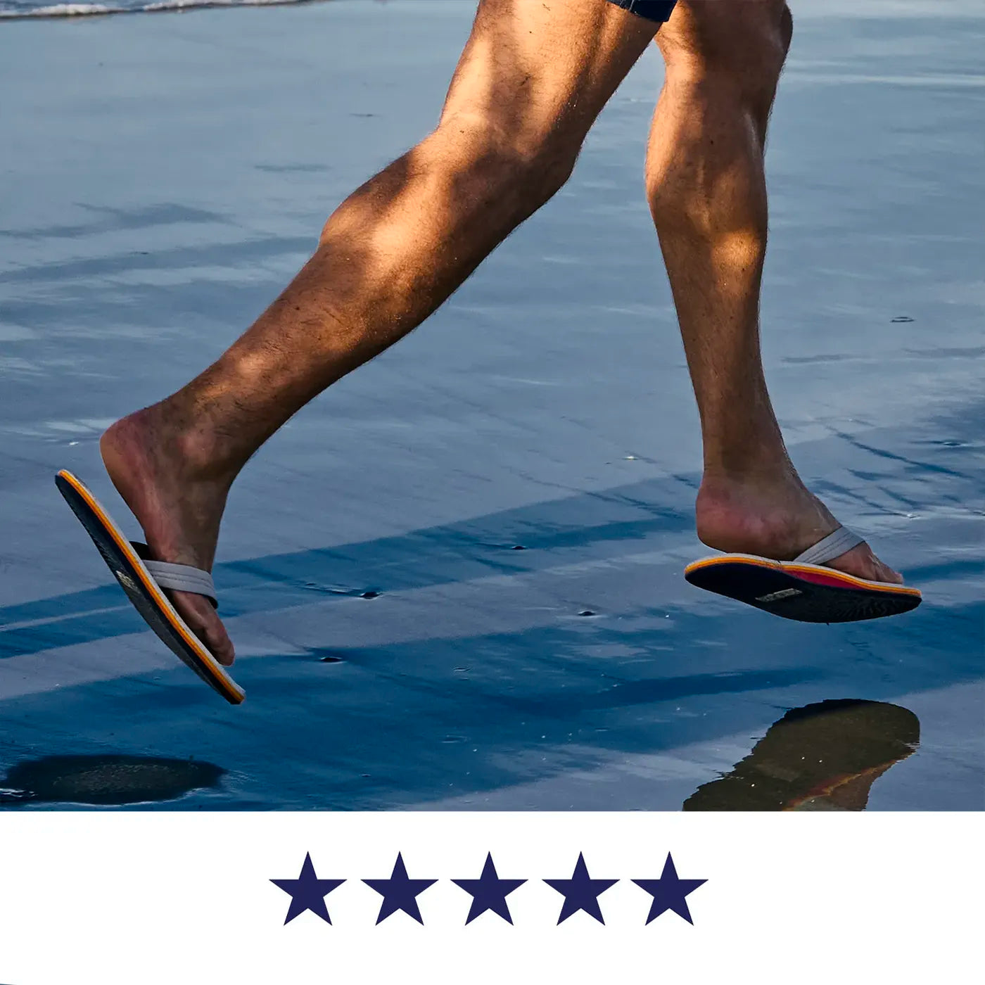 A man wearing Hari Mari flip flops while running on the beach.