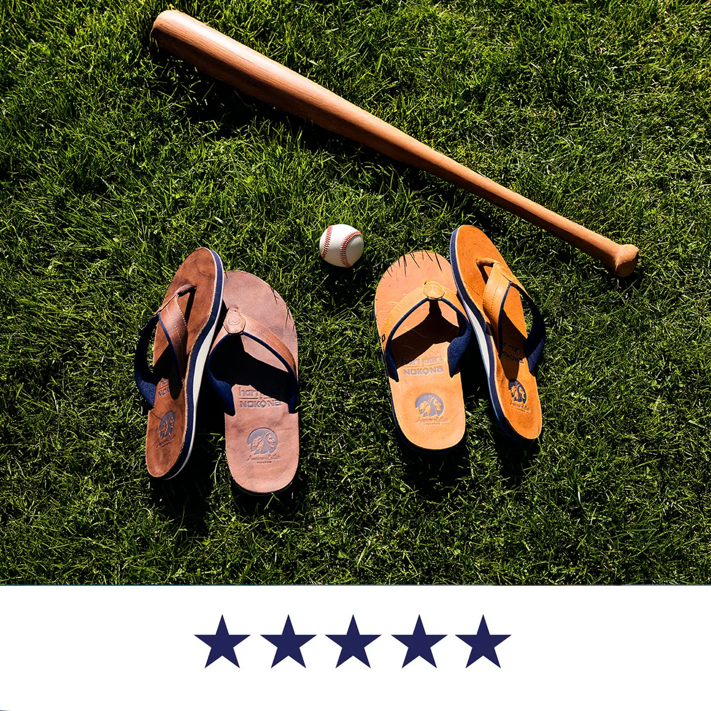 Two pairs of Nokona flip flops on grass with a baseball and bat