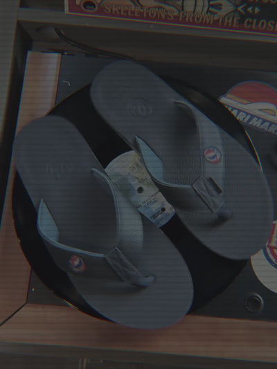 Video showcasing Grateful Dead x Hari Mari flip flops spinning on a record player.