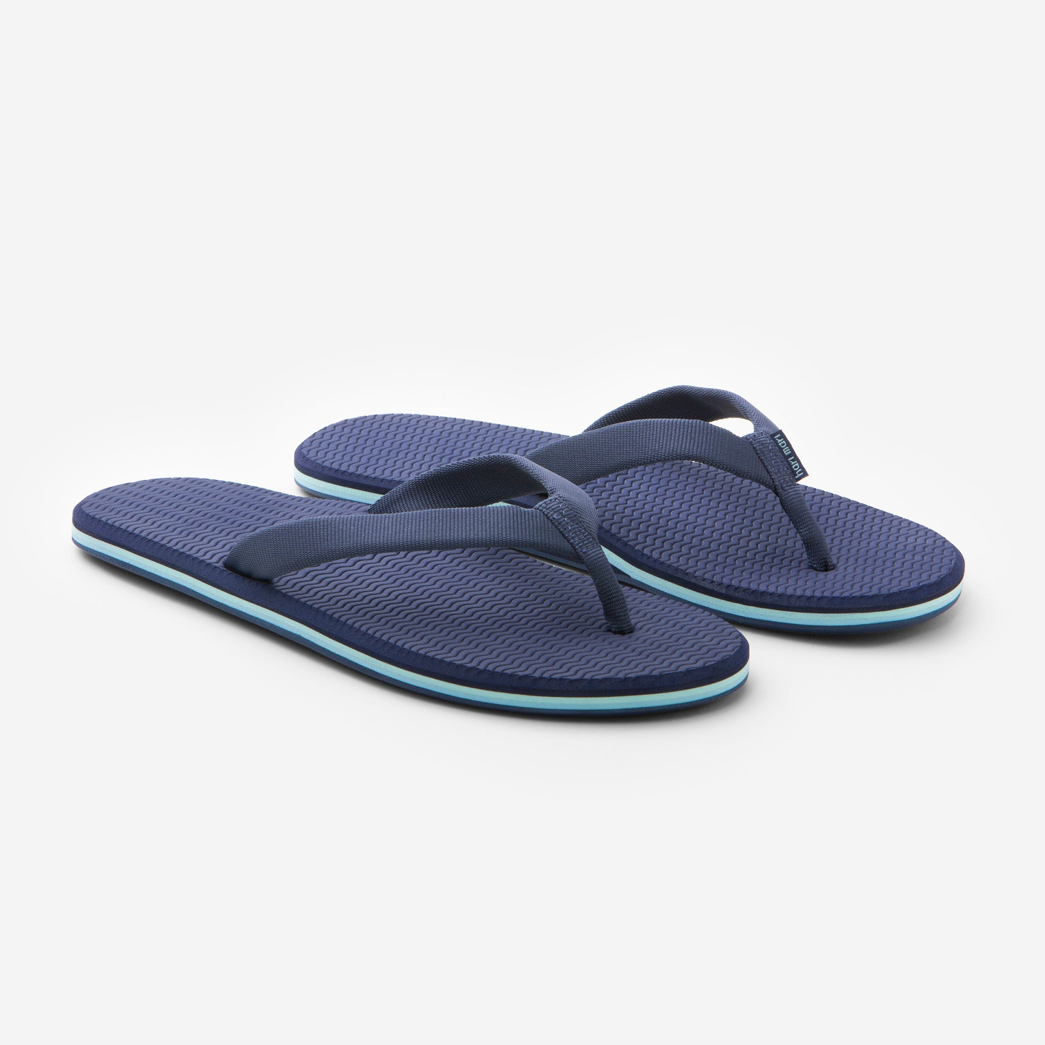 photo of navy blue flip flops 
