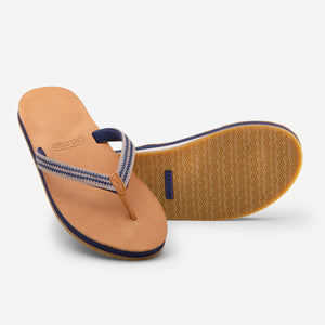 Hari Mari Women's Fields Puebla flip flops in wheat/navy on white background showing flip flop and bottom of flip flop rubber outsole