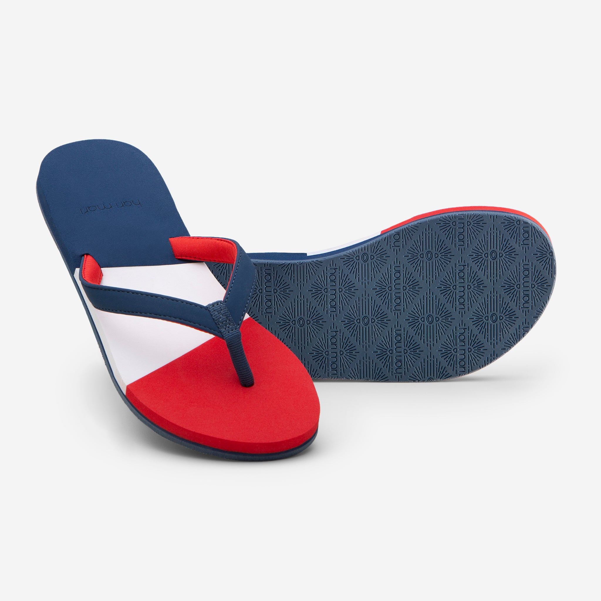 Hari Mari Women's Meadows Asana Flip Flops in Navy/Red/Lily on white background showing flip flop and bottom of flip flop rubber outsole