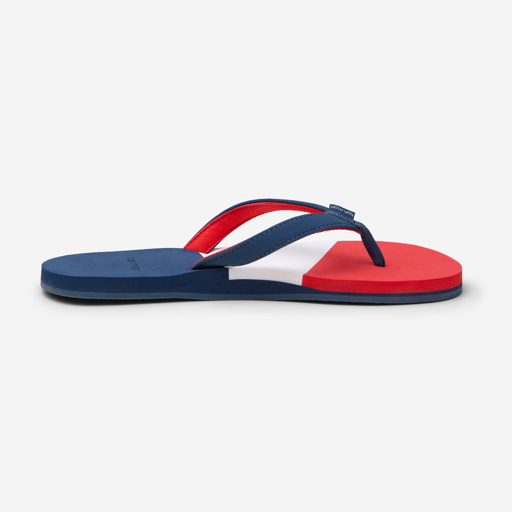 side profile of Hari Mari Women's Meadows Asana Flip Flops in Navy/Red/Lily on white background