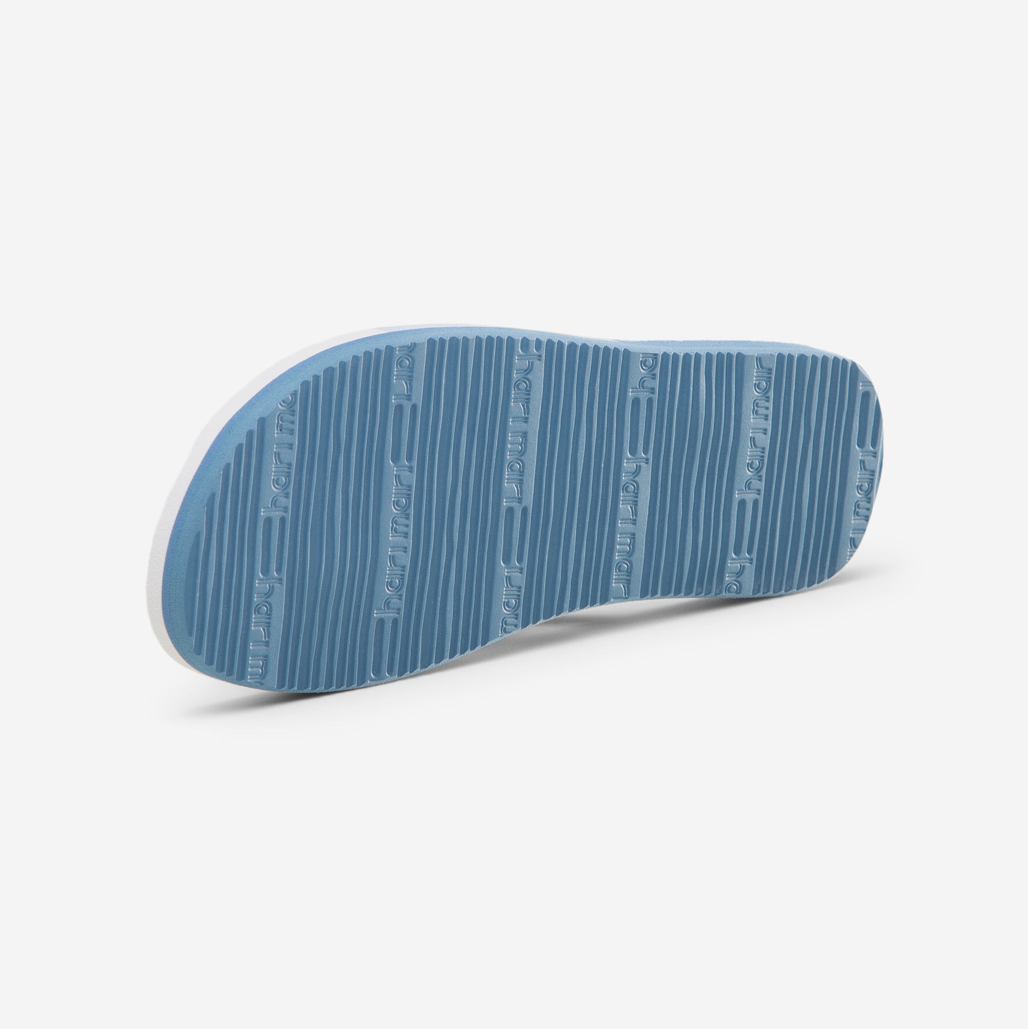 Hari Mari Youth Meadows Asana Flip Flops in Dusty Blue with multi colors bottom of shoe showing rubber outsole on white background